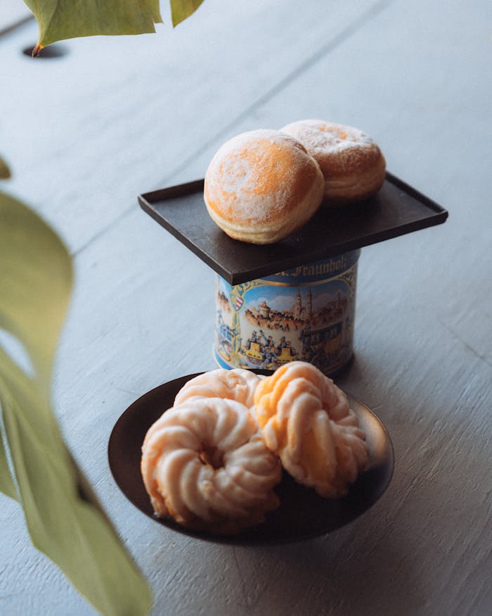 A cozy setup of Berliner and spritzkuchen pastries, perfect for indulgent snacking.