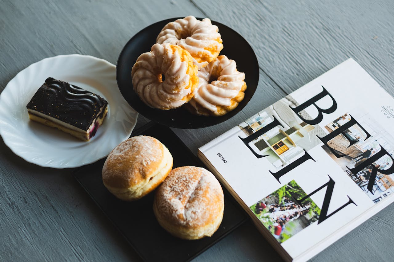 A selection of German sweets and pastries with a Berlin magazine, perfect for a cozy breakfast.